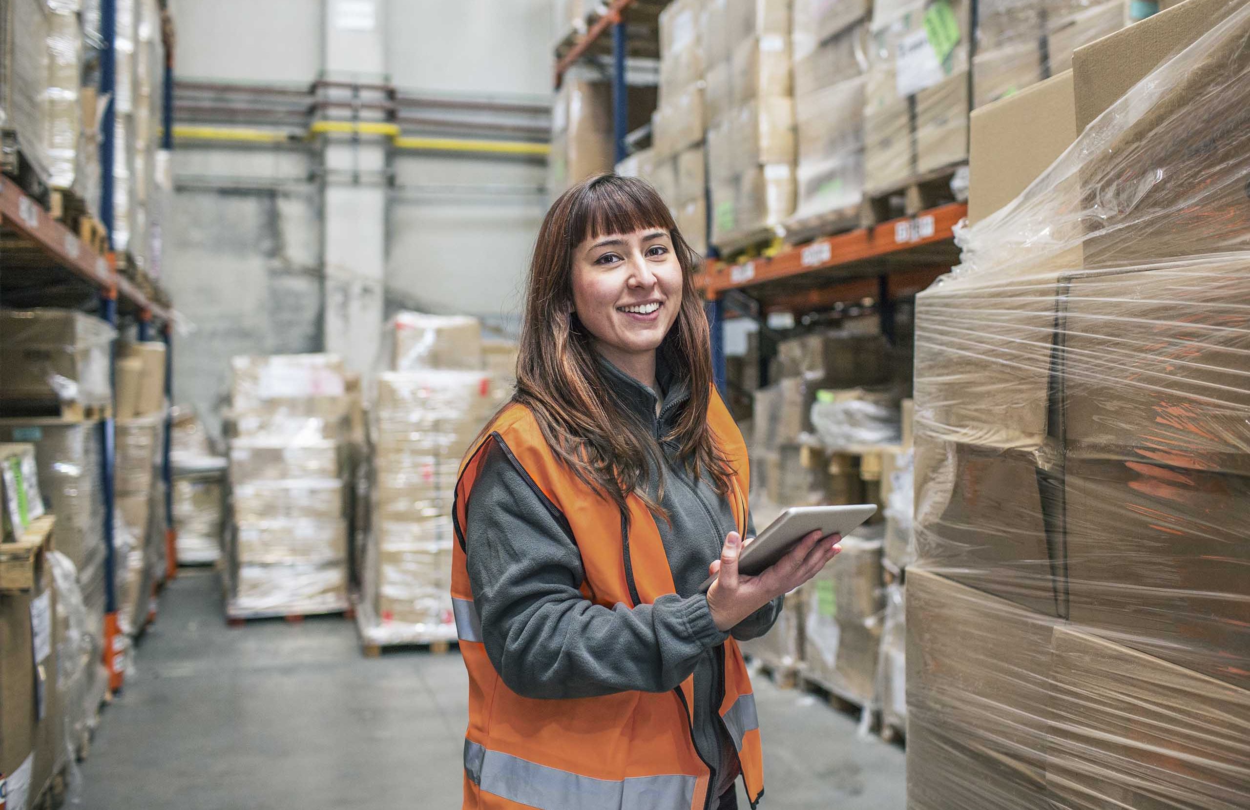 Women holding Ipad in high-vis